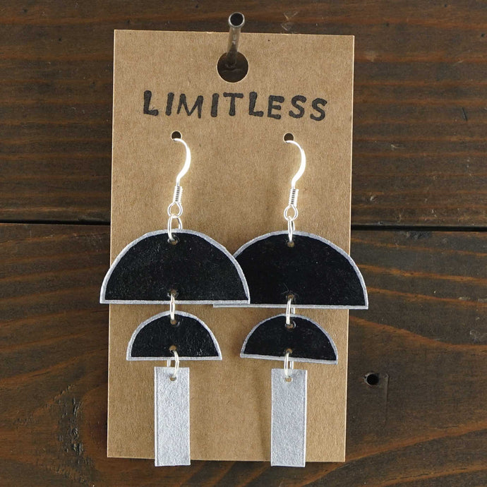 Large, lightweight, geometric statement earrings. Handmade and hand painted in black and silver. Made from recycled paper.