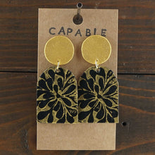Load image into Gallery viewer, Large, lightweight, geometric statement earrings. Handmade and hand painted in black and gold. Made from recycled paper.
