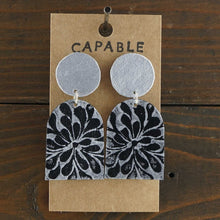 Load image into Gallery viewer, Large, lightweight, geometric statement earrings. Handmade and hand painted in black and silver. Made from recycled paper.
