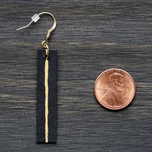 Load image into Gallery viewer, Rectangle dangle earrings made from recycled chipboard, hand painted in black and gold, and made with gold ear wire.
