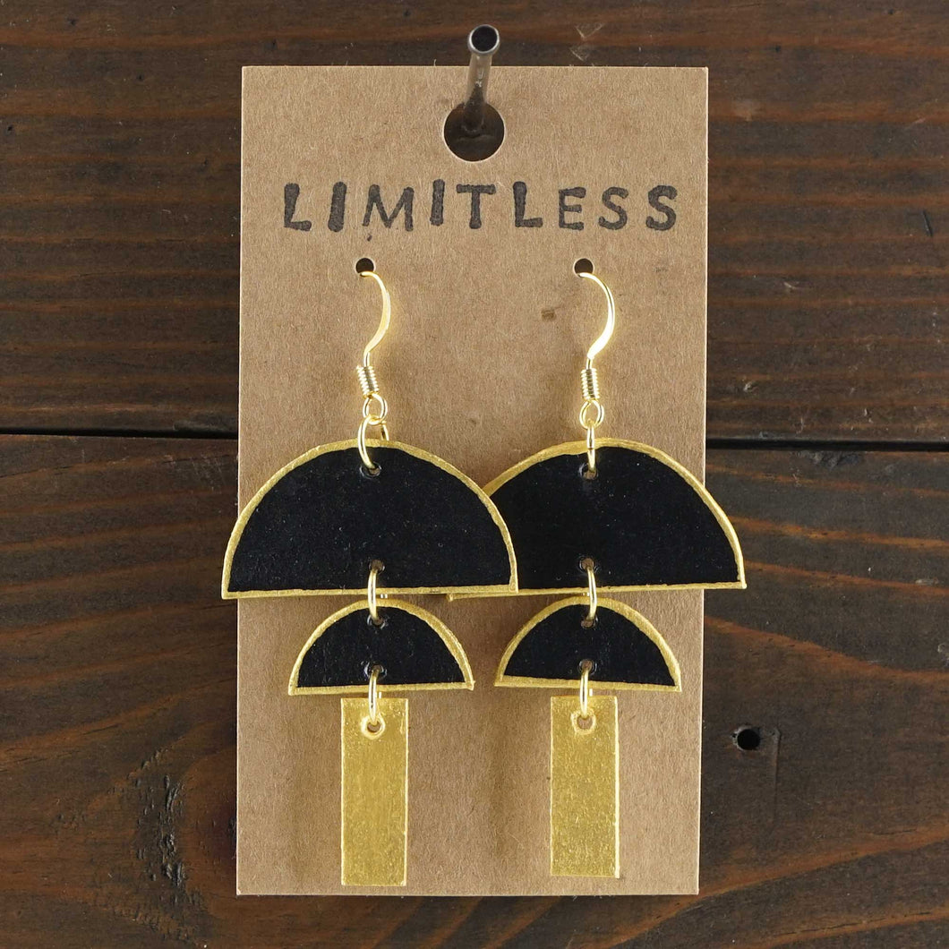 Large, lightweight, geometric statement earrings. Handmade and hand painted in black and gold. Made from recycled paper.